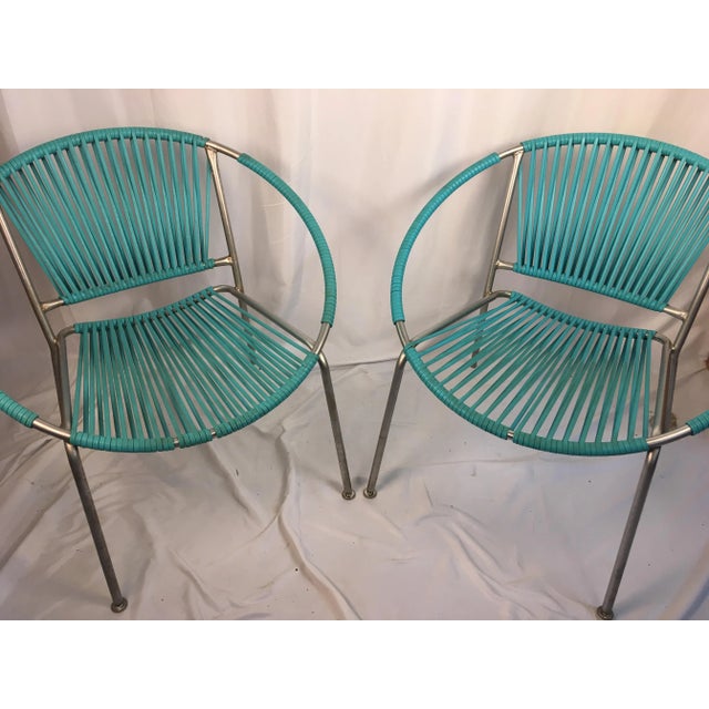 Ames Aire outdoor patio hoop chairs. Each chair is hand wrapped with beautiful turquoise elastic banding. These vintage...
