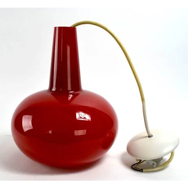 Deep rich red cased glass pendant light in teardrop form. We have two of these, red shades. We have a total of eight of...