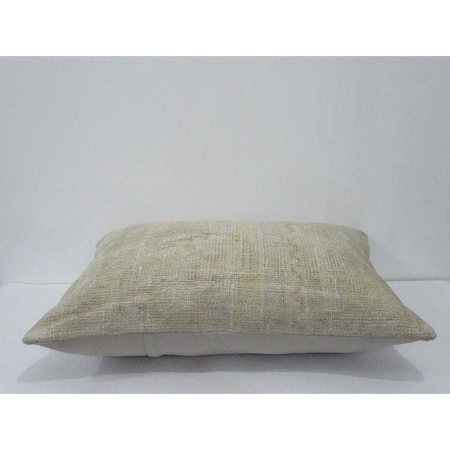 Decorative pillow cover made from a vintage Turkish handknotted rug. Backed with good quality cotton fabric. Pillow...