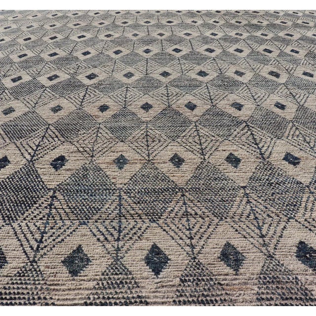 Measures: 10'6 x 13'0 Keivan Woven Arts Large Modern Diamond Design rug in Navy, Blue and Off White. Keivan Woven Arts...