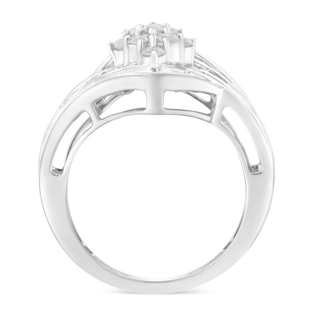 A diamond and gold cluster ring. The ring feature 60 round and baguette diamonds together weighing 1 carat. They are set...