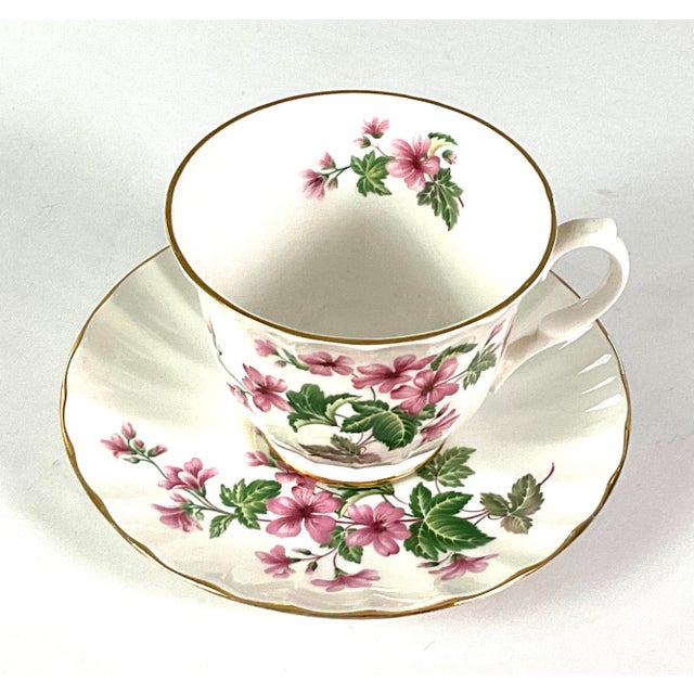 Lefton-English fine bone, China, floral tea, cup, and saucer Note-bone China is an English hardened porcelain Pink and...