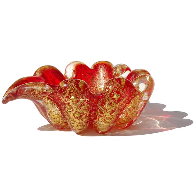 Beautiful vintage Murano hand blown ruby red and gold flecks Italian art glass ribbed ashtray / bowl. The piece is...