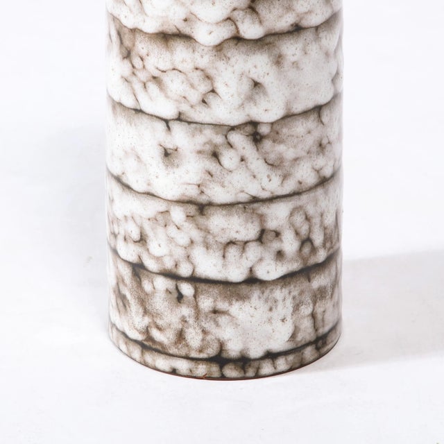 This Mid-Century Modernist ceramic vase with banded detailing is a beautiful example of Post War European Ceramics,...