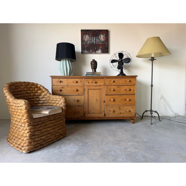 This antique English pine sideboard, dating from 18th century, showcases timeless country craftsmanship and exceptional...