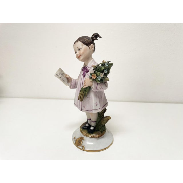 A charming and delicate piece that captures the essence of innocence and sweetness. The little girl is depicted wearing a...