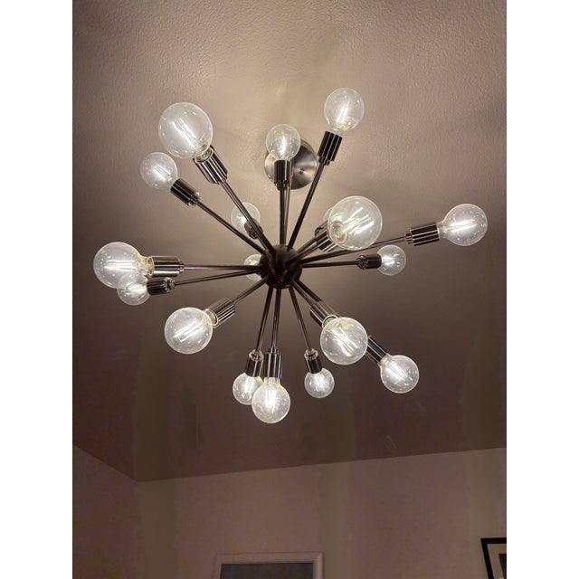 This is a classic Sputnik chandelier, which is an iconic piece of the mid-century modern and space age design that dates...
