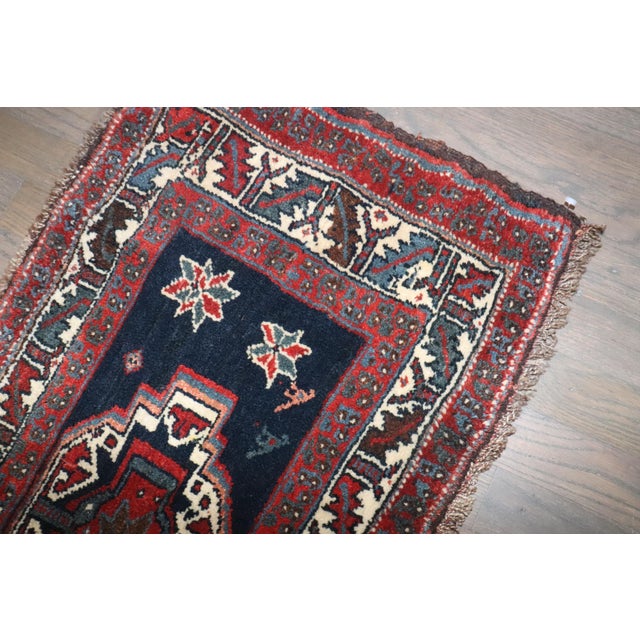 A small size early 20th century Persian Veramin rug in predominantly navy blue Measures: 1'7" x 3'1"