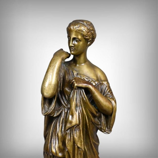 A beautiful gilt bronze cast, signed Raingo Frères, after the famous Roman marble sculpture attributed to Praxiteles (c....