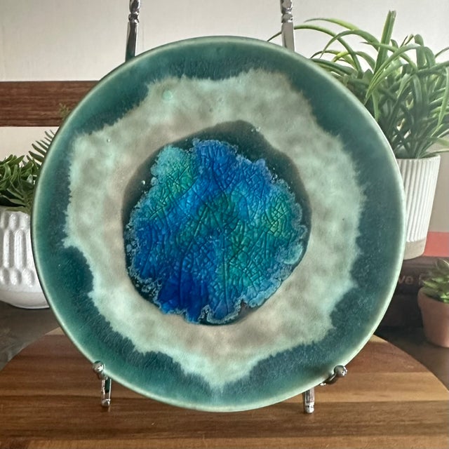 Stunning vintage McCarty Pottery plate in the Dark Jade Waterbottom with Edge colorway. The center has layered blue, teal,...