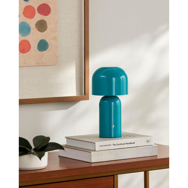 Illuminate your space with the Umbra accent table lamp, a beacon of minimalist modern style. Standing at a sleek 10 inches...
