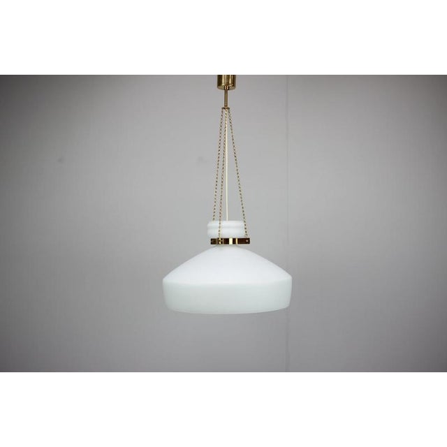 Elegant original czechoslovak pendant lamp dating from circa 1970, designed in the distinctive mid-century modern and...