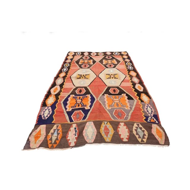 Vintage handwoven decorative kilim rug from Kars region of Turkey. Approximately 50-60 years old. In very good condition.