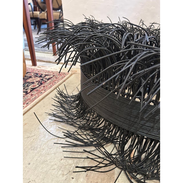 Distinctive stylish black stained rattan large free flowing chandelier by Laura Kirar having steel interior construction...