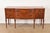 A gorgeous French Regency Louis XVI style sideboard, credenza, or buffet In the manner of Baker Furniture USA, Circa 1940s...