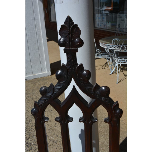 Great looking pair of carved Gothic chairs! A dark wood, almost black in the back & brown seats. Not sure if they are oak....