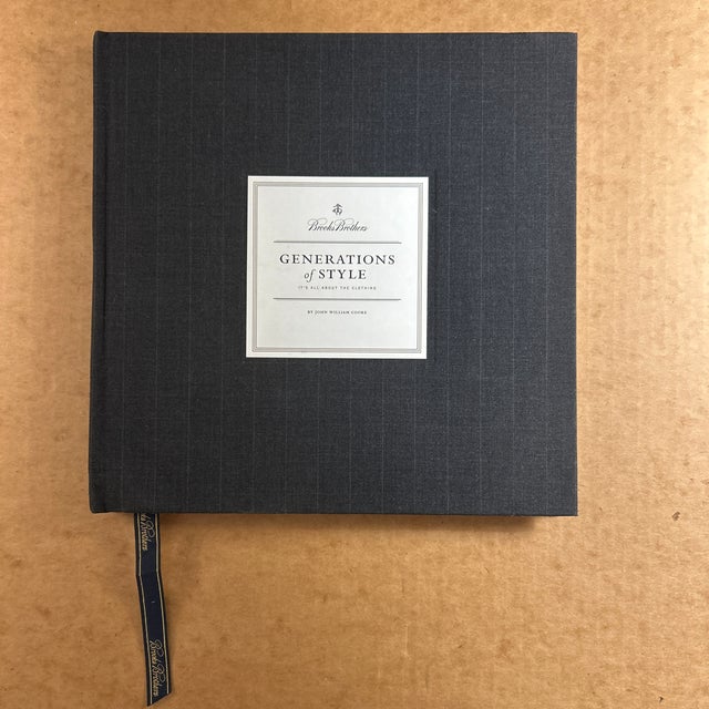 A rare, pristine, factory-sealed copy of Generations of Style, the definitive Brooks Brothers hardcover that chronicles...