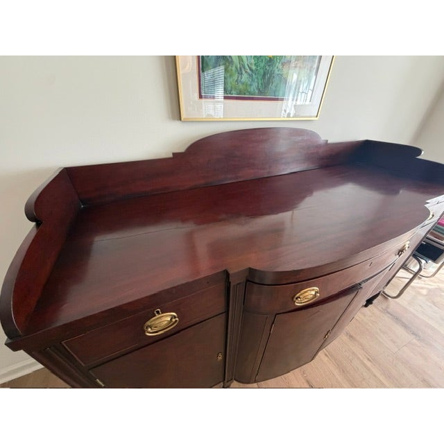 Antique 1920s Federal Revival Flame Mahogany Serpentine Sideboard An elegant and exceptionally well-crafted early 20th-...