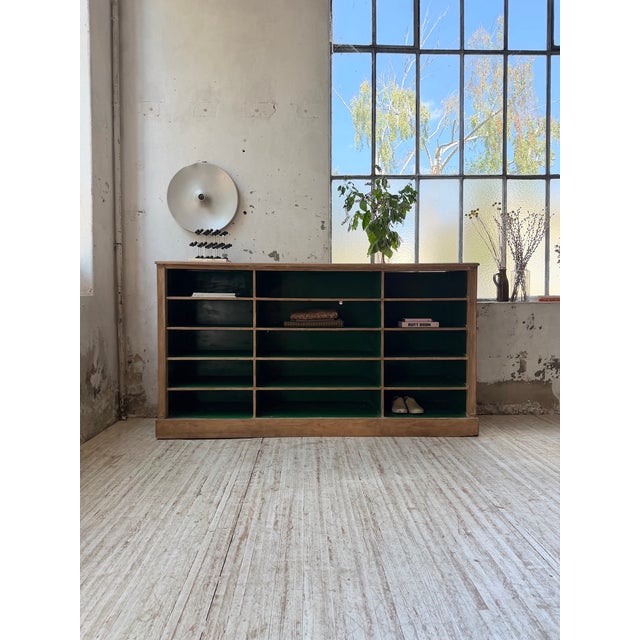Antique 1900s workshop cabinet with an oak frame and ample storage. this large, compartmentalized cabinet retains its...