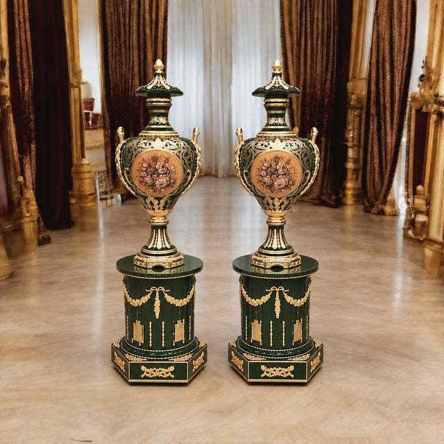 Elevate an elegant interior with this exceptional matching pair of decorative porcelain vases with coordinating pedestals,...