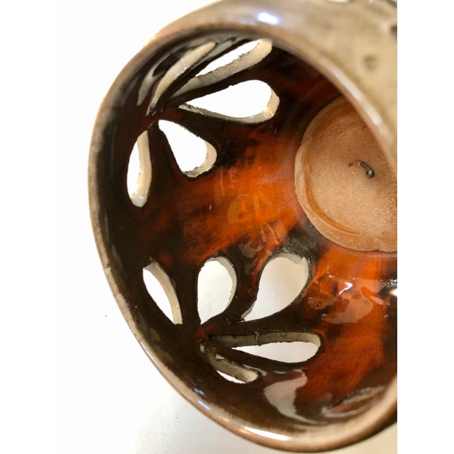 Glit Iceland volcanic lava votive lamp with bright orange natural glaze inside gives the image of its origin. Makers mark...