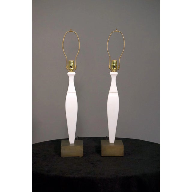 A pair of 20th century Italian white marble and bronze lamps. Rewired. Wear consistent with age and use.