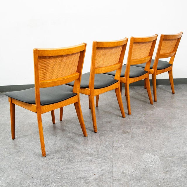 Beautiful American designed set of 5 dining chairs in oak and cane. Unsigned example.