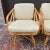 A set of four 20th century Ficks Reed bent rattan swivel chairs with light yellowish green cushions. American made. Circa...