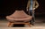 Low-slung gondola-form lounge chair designed after Luigi Tiengo, a Montreal-based furniture designer recognized as an...