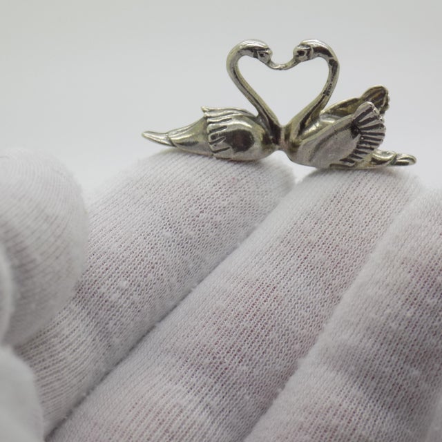 A delicate and elegant composition, celebrating one of the most universal symbols of love, fidelity, and purity. The two...