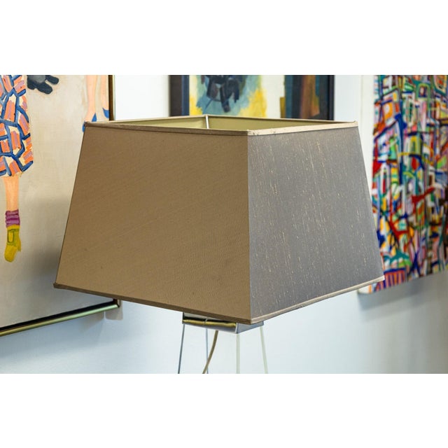 A 1980s lucite and chrome table lamp. A lovely little table lamp with a two panel lucite frame, connected with chrome...
