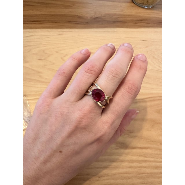 This beautiful ring features a 4.7 carat Ruby solitaire and a criss cross split shank set in solid 14K gold. This...
