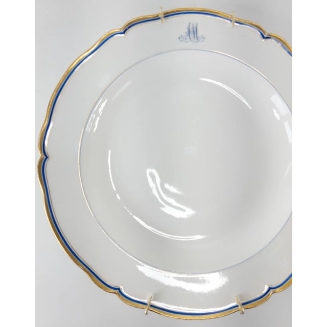 We are selling this decorative German porcelain charger by KPM. This large plate has simple blue and gold decoration with...
