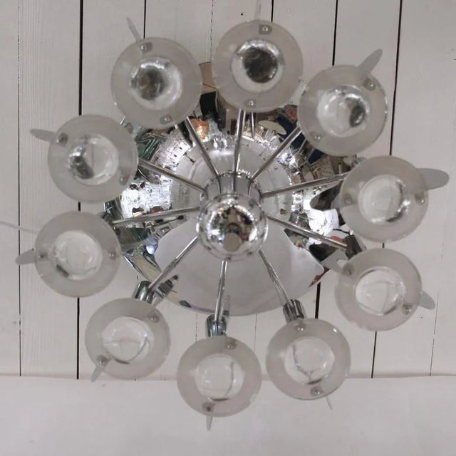 - Italian sculptural ceiling light from the 1970s - Chrome steel structure with blown clear glass - Created by Italian...