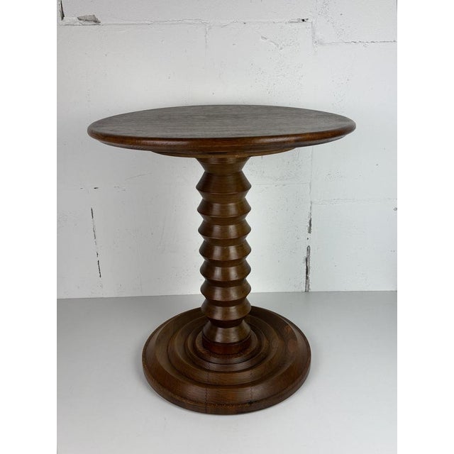 Stunning French side table from the 1940s- 1950s constructed in medium dark oak. The bases are generally made of...