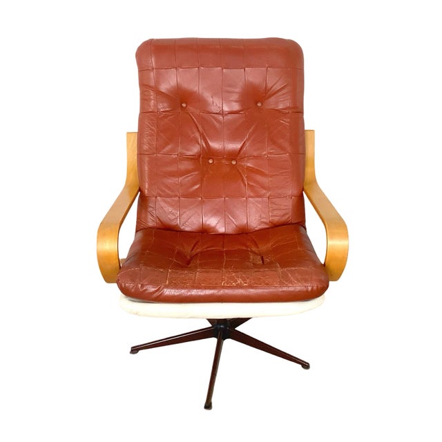 Add a distinct retro look to your curated interior with this stylish mid-century modern style swivel lounge chair....