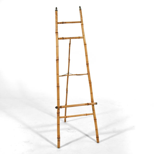 Elegant, light, but strong, this floor easel is made of bamboo with brass details and is the perfect way to display your...