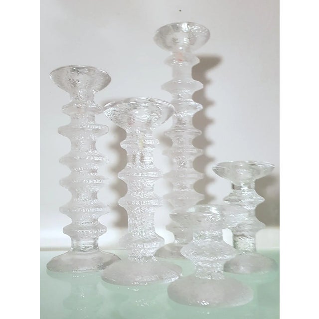 Festivo is a series of glass candle holders designed by Timo Sarpaneva in 1966 for the Finnish glass manufacturer Iittala....