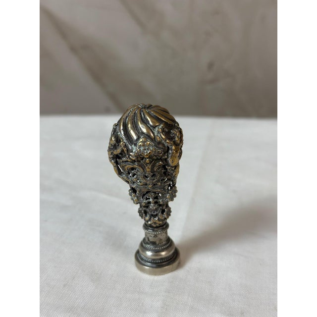 An elegant 18th-century seal, featuring a remarkable openwork handle in the shape of a hot air balloon. Its finely crafted...