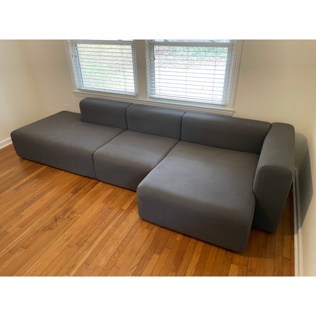 Hay Mags Low Sectional, 1 arm wide with chaise, right orientation, 3 sections. Charcoal Mode fabric upholstery. The center...