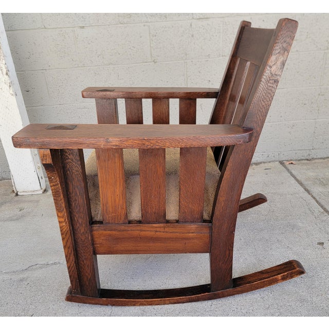 Unusual and fine Mission Oak / Arts & Crafts rocking chair. Circa. 1910. Crafted with through tenon and peg construction....