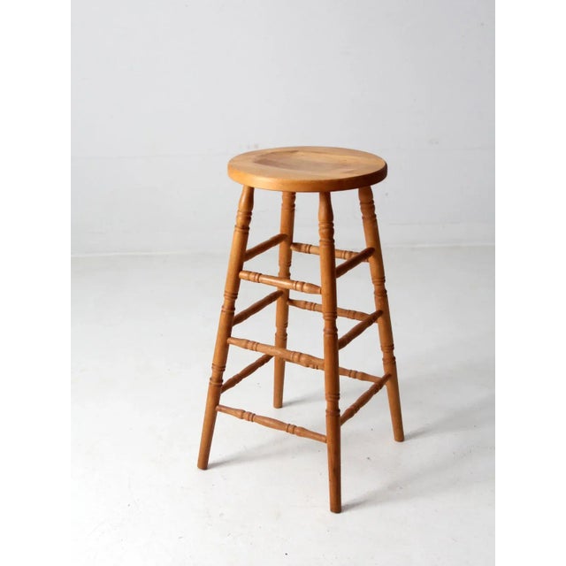 This is a vintage Union City Chair Company stool circa early to mid 20th century. The tall, natural wood stool features...