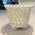 This white ceramic cache pot is so fabulously 1960s. It takes it shape from white ceramic "rope" loosely woven into the...