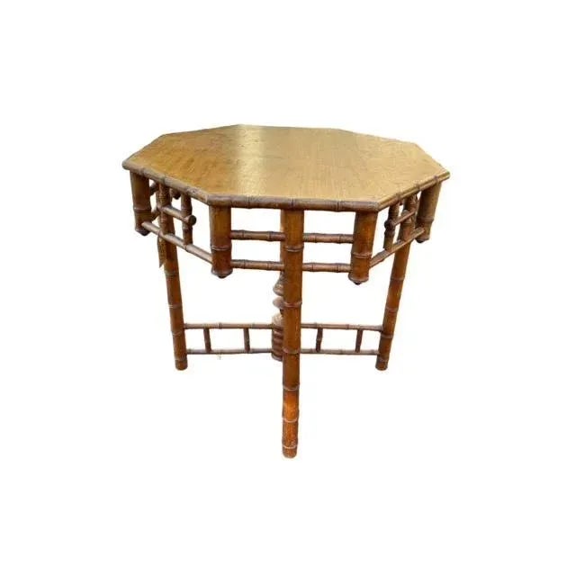 Faux bamboo table with finial accent on the base. This piece would work well in a Victorian or midcentury decor.