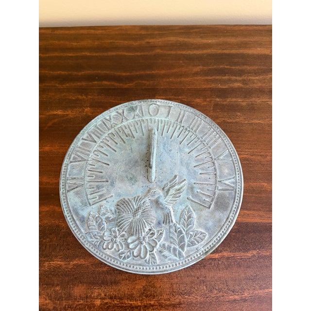 A stunning vintage iron verdigris garden sundial featuring a charming hummingbird USA, Late 20th Century Measures: 8"W x...