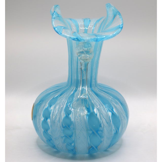 A stunning and intricately crafted vintage mid-century Murano art glass vase, featuring classic Italian elegance and...