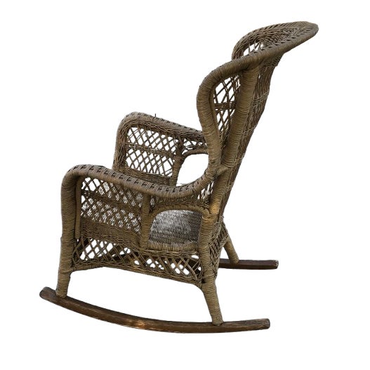 Hi, large vintage wood wicker rocking chair. Was painted white and most of the paint has fallen off. Wear consistent with...