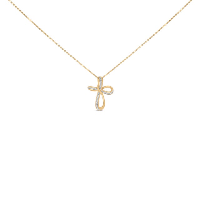 An emblem of endless grace, this pendant traces a soft ribbon into a cross, then loops gently into infinity—a whisper of...