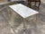 This is a classic French Louis XVI style coffee table. Made of quality brass, the base features fluted legs and an elegant...
