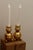 Made in Sweden. A pair of Swedish brass candle holders shaped like spheres and resting on three balled feet. These candle...